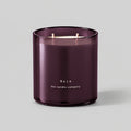 Baie 400g candle with two cotton wicks on a neutral grey background