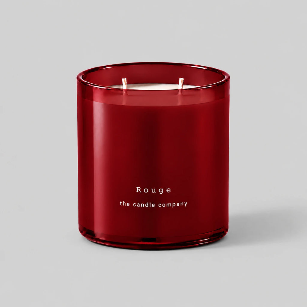 Rouge 400g candle with two cotton wicks on a neutral grey background