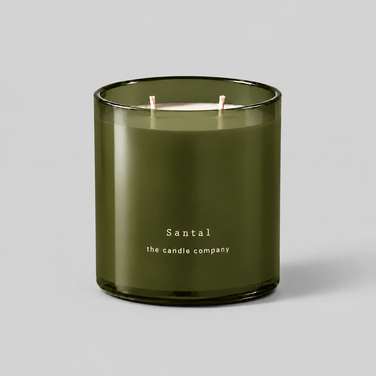 Santal 400g candle with two cotton wicks on a neutral grey background