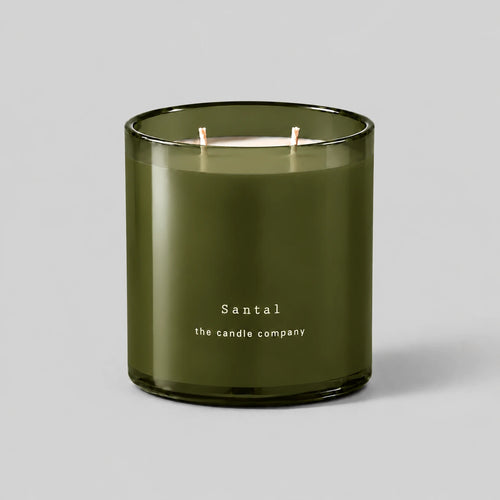 Santal 400g candle with two cotton wicks on a neutral grey background